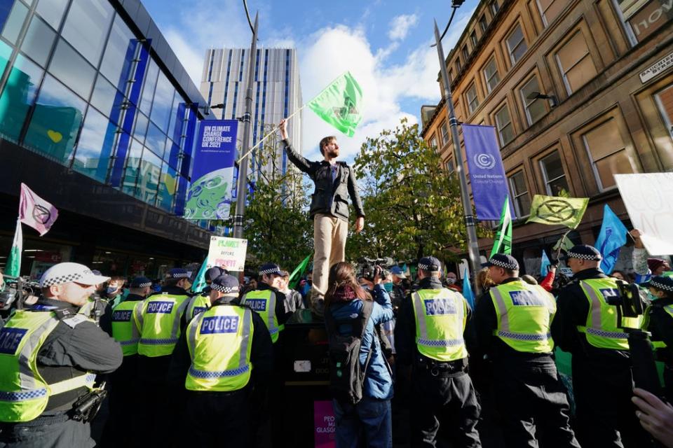 Police and demonstrators at a Extinction Rebellion protest on Buchanan Street (Jane Barlow/PA) (PA Wire)