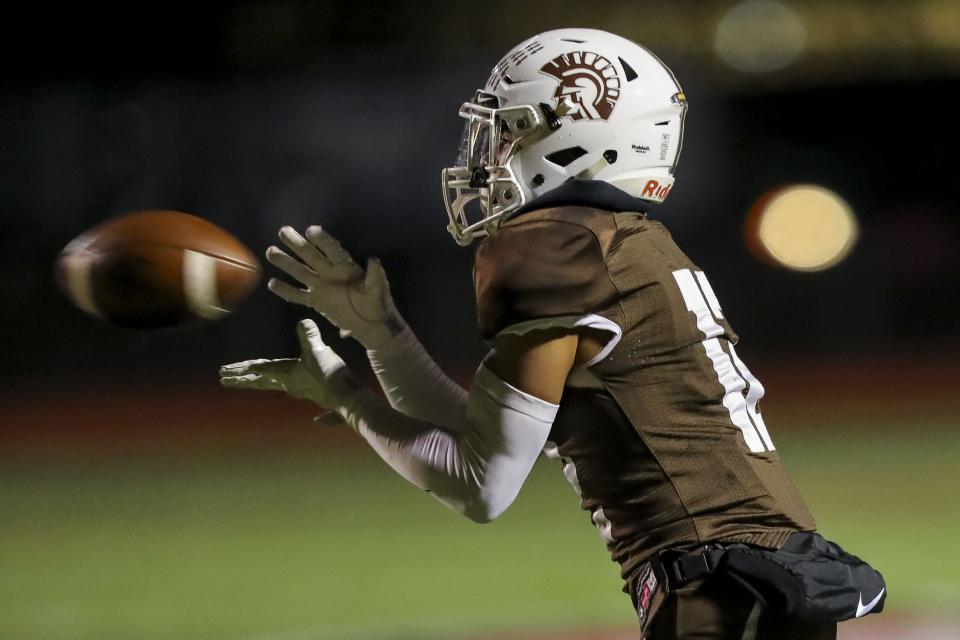 Roger Bacon wide receiver Eric Johnson (12) catches a pass against Preble Shawnee in the second half at Lakota West High School, Nov. 13, 2021.