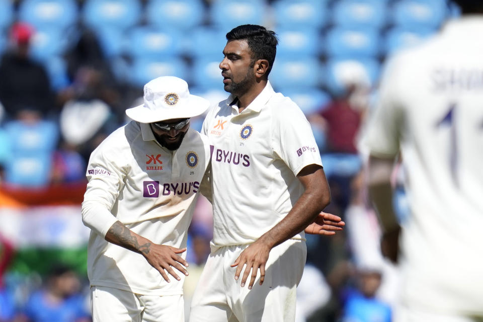 India's Ravichandran Ashwin, right, celebrates the wicket of Australia's cricket captain Pat Cummins with his team player India's Ravindra Jadeja, during the first day of the first cricket test match between India and Australia in Nagpur, India, Thursday, Feb. 9, 2023. (AP Photo/Rafiq Maqbool)