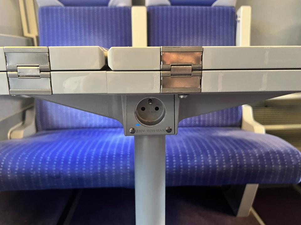 An outlet under a table on a TGV Lyria