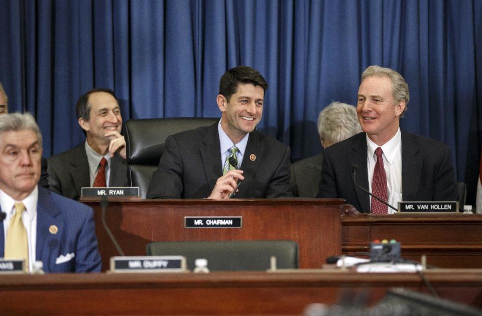 House Budget Committee Chairman Rep. Paul Ryan, R-Wis., presides over a markup session where House Republicans are are pressing ahead with a slashing plan to try to balance the budget within 10 years, relying on big decreases in health care programs for the middle class and the poor, as well as tax hikes and Medicare cuts engineered by President Barack Obama. Ryan is flanked by Rep. Chris Van Hollen, D-Md., right, the ranking member, and Rep. Roger Williams, R-Texas, lower left. (AP Photo/J. Scott Applewhite)