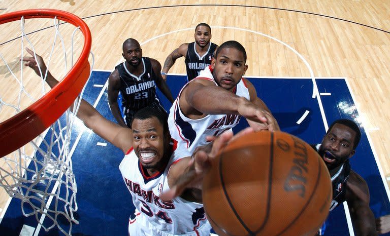 Jason Collins (L), playing for the Atlanta Hawks, is pictured during a game at Philips Arena in Atlanta, Georgia on April 28, 2011. Collins has become the first active player in a major American professional team sport to reveal he is gay -- a groundbreaking disclosure greeted with broad support