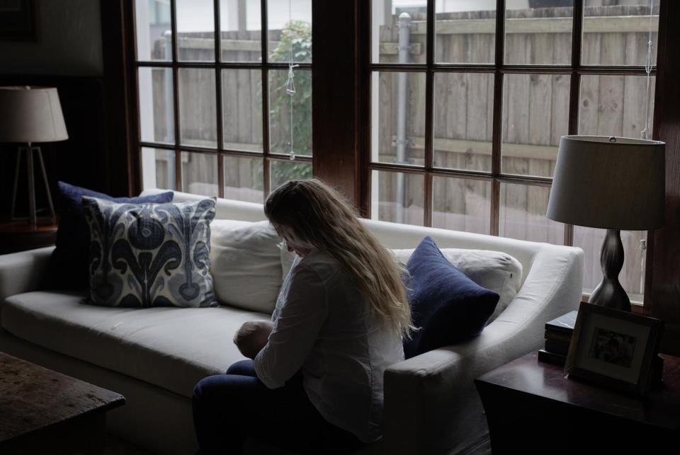 Lauren Miller breastfeeds her two-month-old son Henry at her home in Dallas on June 16, 2023. Miller needed to perform a selective abortion in order to save her and one of her twin's lives, but due to the overturn of Roe v. Wade and restrictive abortion laws in her home state, she had to travel to Colorado to get the procedure done.