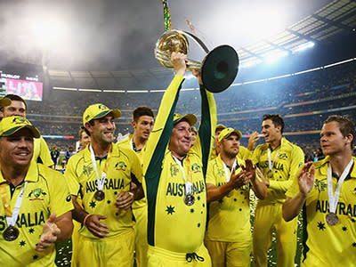 Brad Haddin lifts the trophy as the Aussies celebrate.