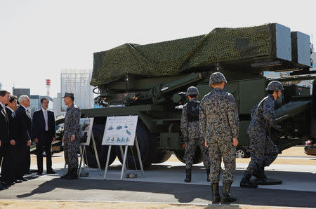 U.S. Vice President Mike Pence inspects PAC-3 missile interceptors with Japan's Defense Minister Itsunori Onodera at the Defense Ministry in Tokyo, Japan February 7, 2018. REUTERS/Toru Hanai