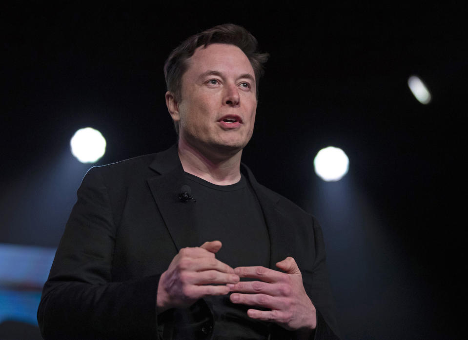 FILE - In this Thursday, March 14, 2019 file photo, Tesla CEO Elon Musk speaks before unveiling the Model Y at the company's design studio in Hawthorne, Calif. Musk is funding the 2019 XPRIZE for $10 million, which presented a challenge: Come up with open-sourced software that could easily be downloaded onto tablets used by illiterate children to teach themselves to read. But thatâ€™s what nearly 200 teams from around the world have spent more than a year in impoverished villages in Tanzania trying to do. The winner of this latest competition will be announced in Los Angeles Wednesday, May 15. (AP Photo/Jae C. Hong, File)