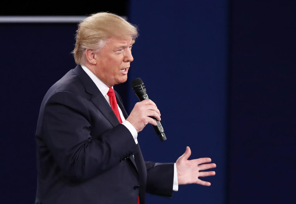 <p>Donald Trump responds to questions during the town hall debate at Washington University on Oct. 9, 2016 in St Louis, Mo. (Photo: Win McNamee/Getty Images) </p>