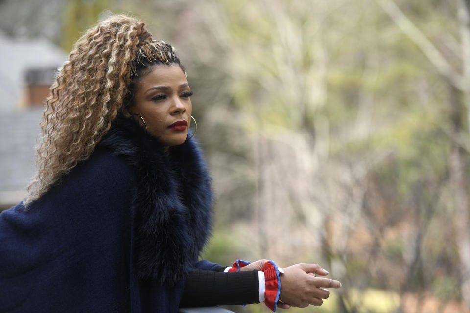 In this Jan. 18, 2019 photo, singer and TV personality Syleena Johnson poses for a photo at her home in Alpharetta, Ga. Johnson, who appeared in the reality series “R&B Divas” and co-hosts the TV One daytime talk show, “Sister Circle,” sang the 2001 song, “I Am Your Woman," which was written and produced by R. Kelly. (AP Photo/Annie Rice)