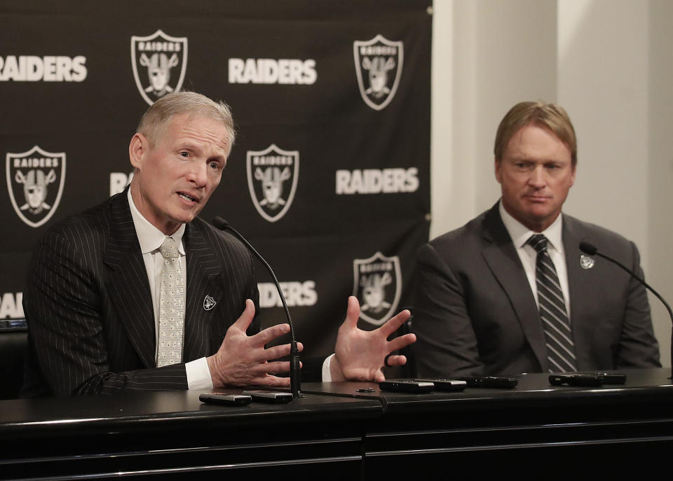 Mike Mayock, left, and Jon Gruden have a lot of options in this week's draft. (AP)