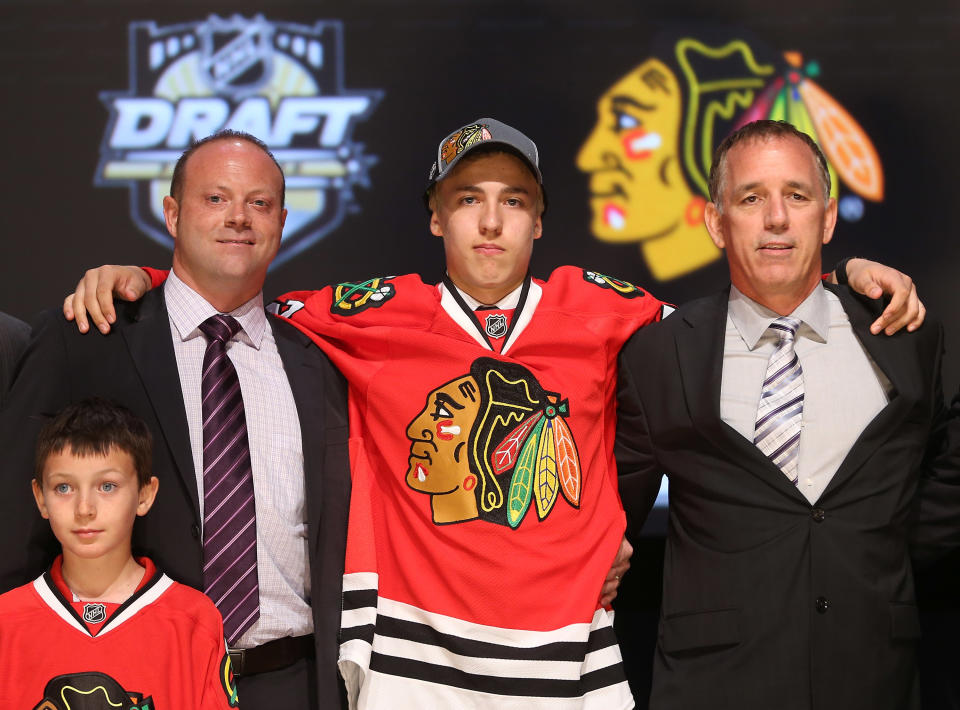 PITTSBURGH, PA - JUNE 22: Teuvo Teravainen (C), 18th overall pick by the Chicago Blackhawks, poses with Blackhawks representatives on stage during Round One of the 2012 NHL Entry Draft at Consol Energy Center on June 22, 2012 in Pittsburgh, Pennsylvania. (Photo by Bruce Bennett/Getty Images)