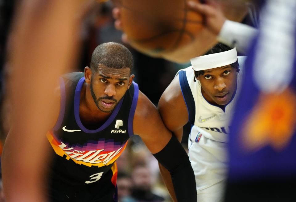 May 10, 2022; Phoenix, Arizona; USA; Suns Chris Paul (3) and Mavericks Frank Ntilikina (21) watch free throws during game 5 of the second round of the Western Conference Playoffs.