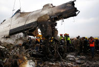 <p>Rescue workers work at the wreckage of a US-Bangla airplane after it crashed at the Tribhuvan International Airport in Kathmandu, Nepal, March 12, 2018. (Photo: Navesh Chitrakar/Reuters) </p>