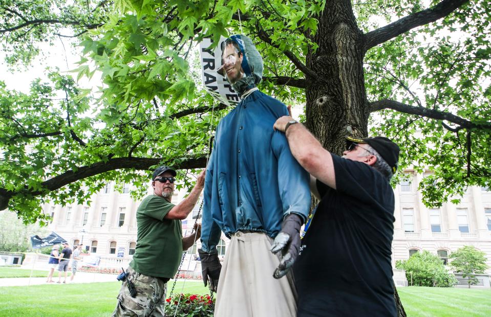 Protesters hang an effigy of Kentucky Gov. Andy Beshear in Frankfort on May 25, 2020.