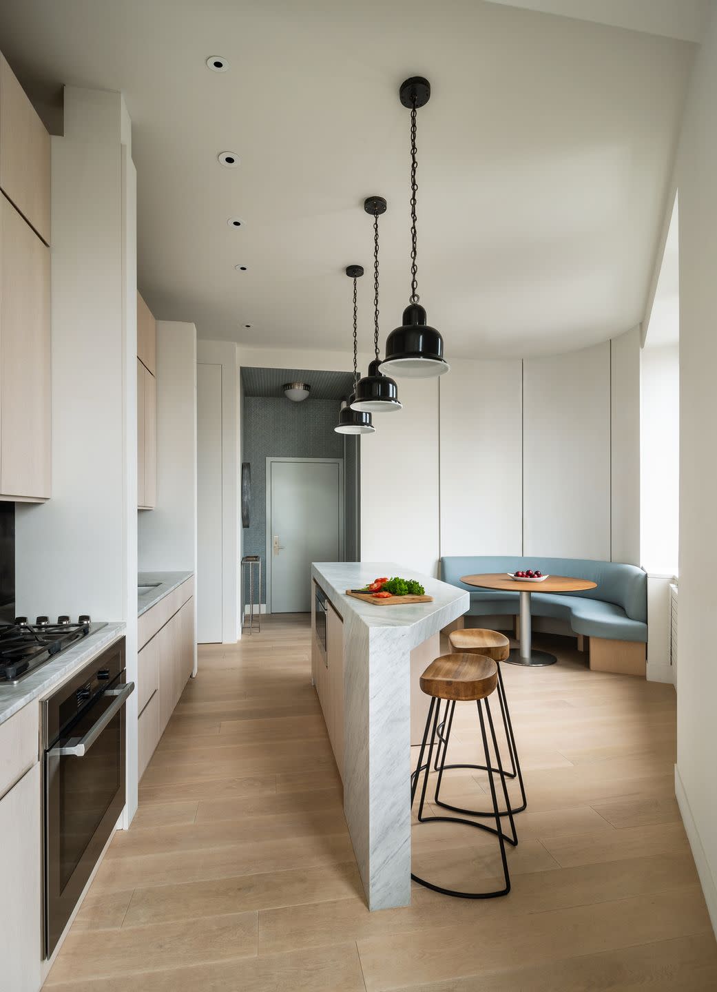 kitchen with marble island and banquette