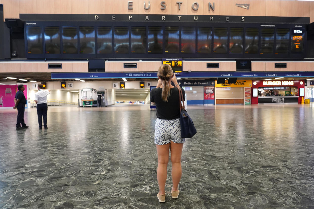 A person at Euston station in London, as members of the Rail, Maritime and Transport union begin their nationwide strike along with London Underground workers in a bitter dispute over pay, jobs and conditions. Picture date: Tuesday June 21, 2022.