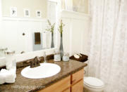 <body> <p>A few cosmetic changes made all the difference! The inexpensive DIY board-and-batten treatment gives the room a bright facelift, while accents like a floral shower curtain, glass canisters, and handcrafted <a rel="nofollow noopener" href=" http://www.bobvila.com/articles/diy-mirror-frame-projects/#.Va-v8SpViko?bv=yahoo" target="_blank" data-ylk="slk:mirror frame;elm:context_link;itc:0;sec:content-canvas" class="link ">mirror frame</a> flesh out the fresh new style.</p> <p><strong>Related: <a rel="nofollow noopener" href=" http://www.bobvila.com/slideshow/20-ways-to-make-a-small-bathroom-big-2350?bv=yahoo" target="_blank" data-ylk="slk:20 Ways to Make a Small Bathroom Big;elm:context_link;itc:0;sec:content-canvas" class="link ">20 Ways to Make a Small Bathroom Big</a> </strong> </p> </body>