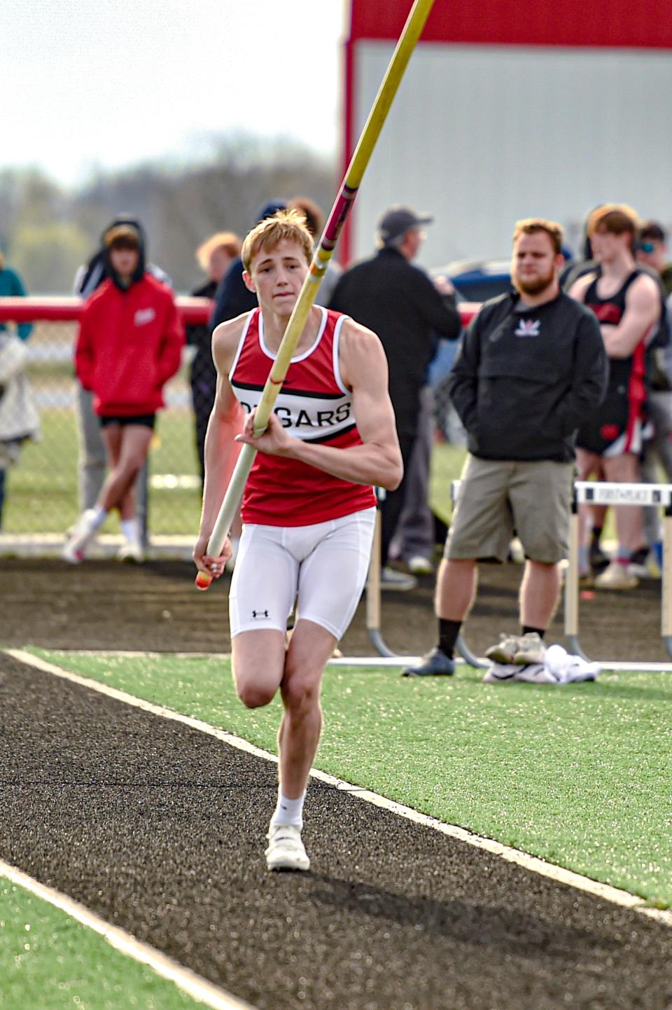 Crestview's Liam Kuhn runs down the runway during the pole vault competition of the 2024 Forest Pruner Track Invite on Friday.