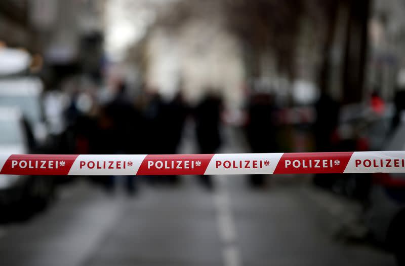 Policemen guard the entrance of a school, after authorities put the school under isolation after a teacher returned from a travel in Northern Italy, in Vienna