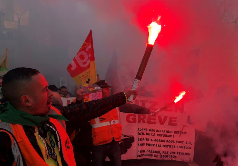 French SNCF railway workers on strike attend a demonstration in Paris