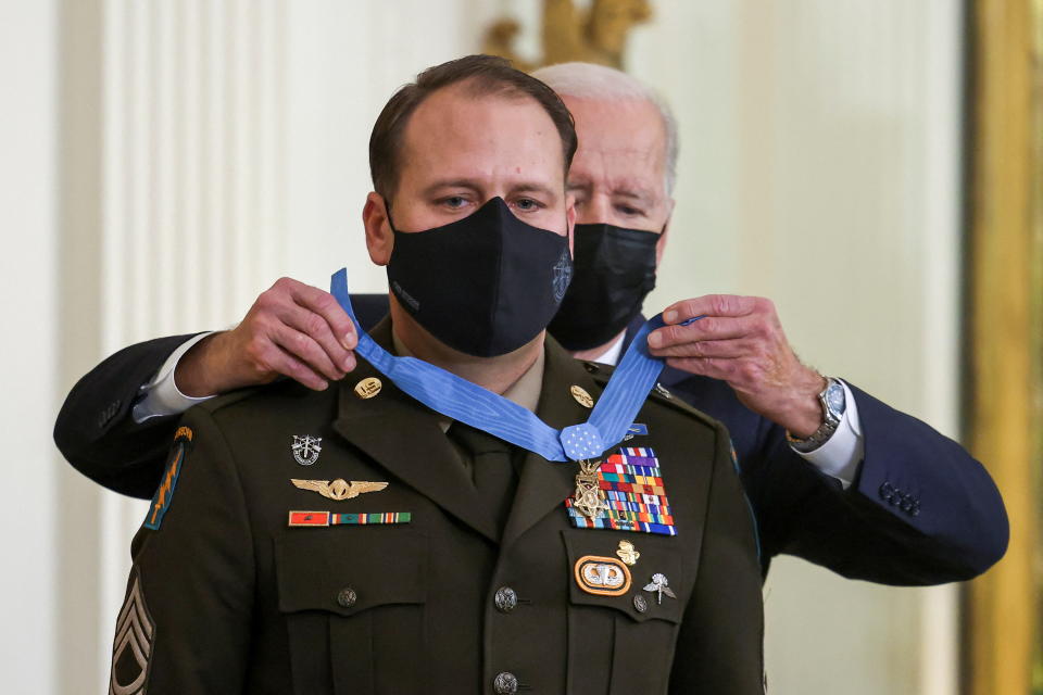 U.S. President Joe Biden awards the Medal of Honor to Master Sergeant Earl D. Plumlee, United States Army, for conspicuous gallantry, in Washington, U.S., December 16, 2021. REUTERS/Evelyn Hockstein