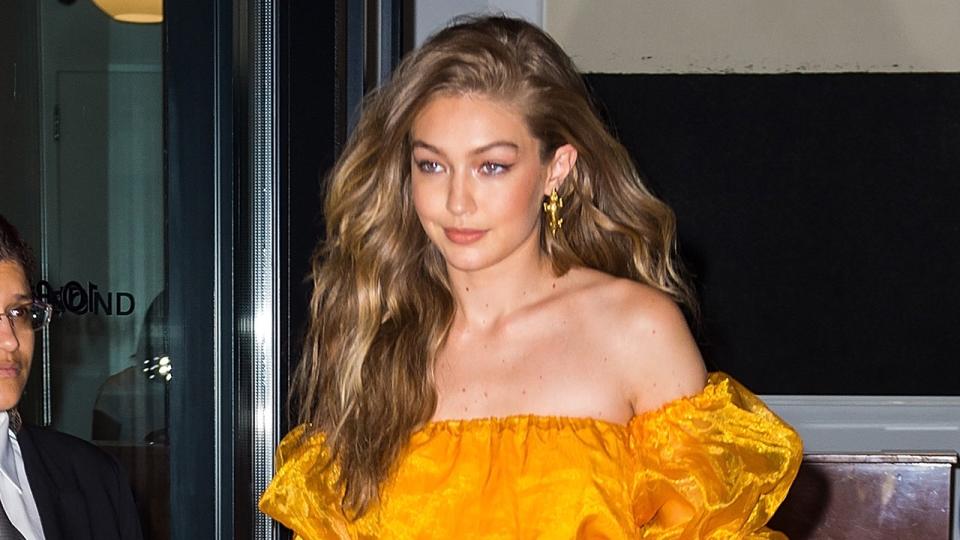 The supermodel turned heads in a frothy, honey-colored, off-the-shoulder cropped number for a party in New York City.