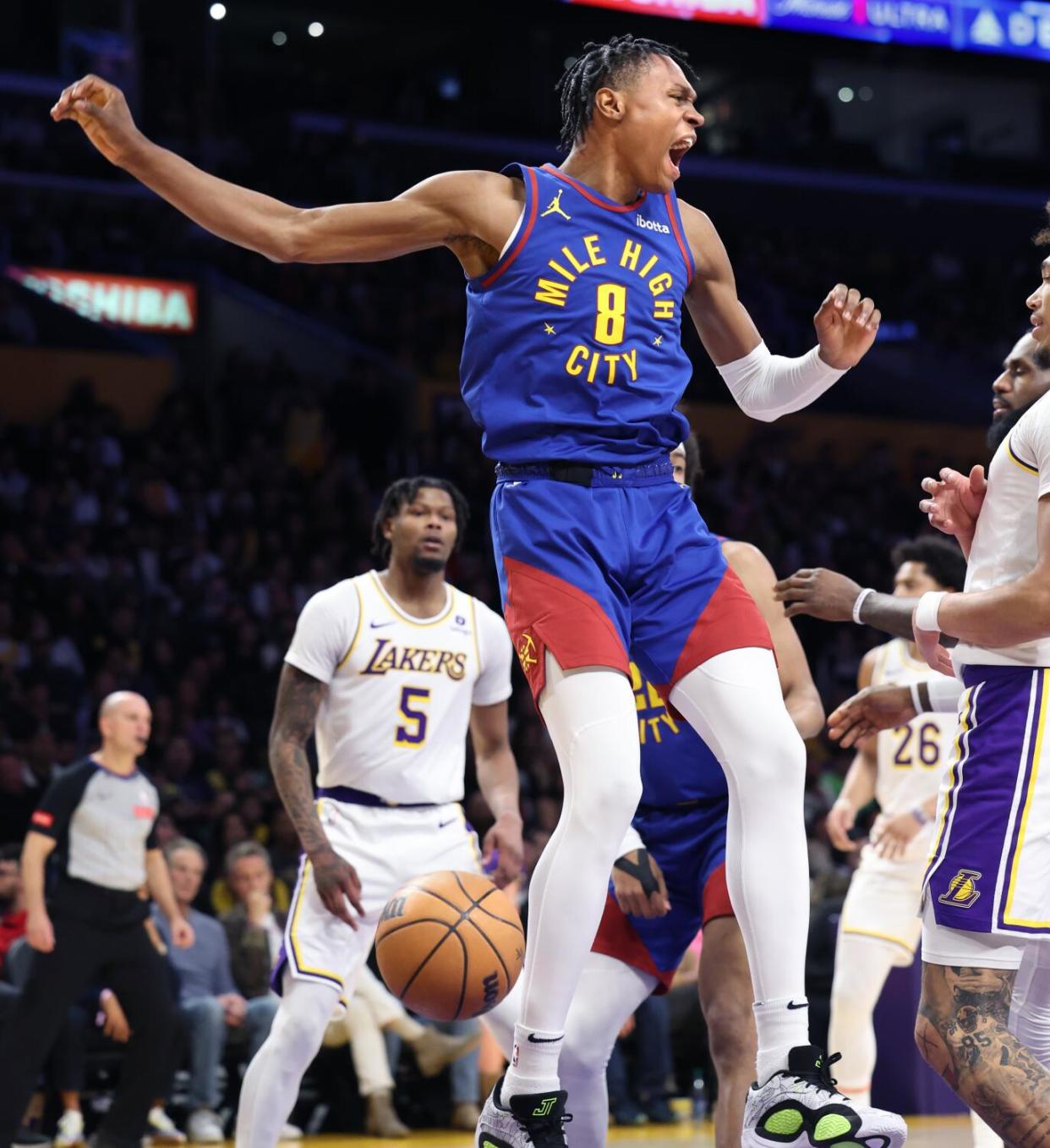 Nuggets forward Peyton Watson celebrates after dunking on the Lakers during a Denver win on March 2.