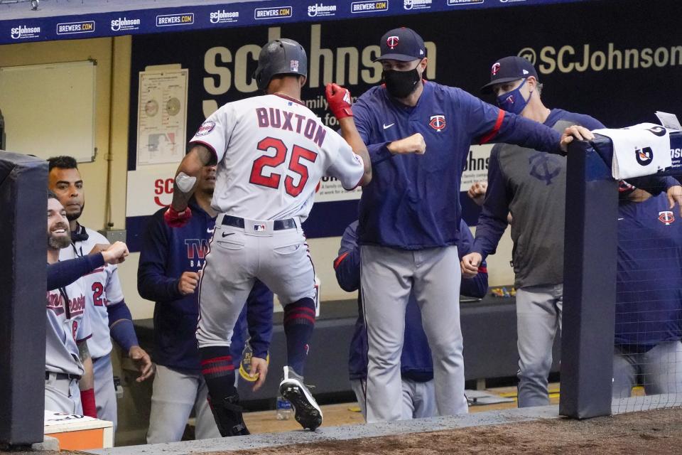 Minnesota Twins' Byron Buxton celebrates after hitting a home run during the fifth inning of a baseball game against the Milwaukee Brewers Wednesday, Aug. 12, 2020, in Milwaukee. (AP Photo/Morry Gash)