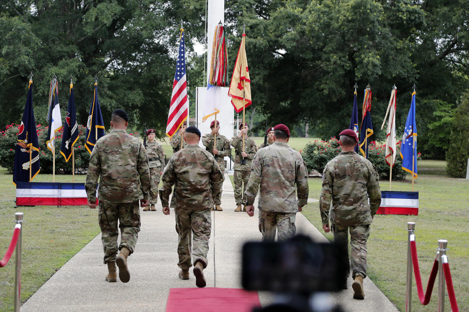 Commanding officers approach the color guard during a ceremony to rename Fort Bragg, Friday, June 2, 2023, in Fort Liberty, N.C., The U.S. Army changed Fort Bragg to Fort Liberty as part of a broader initiative to remove Confederate names from bases. (AP Photo/Karl B DeBlaker)