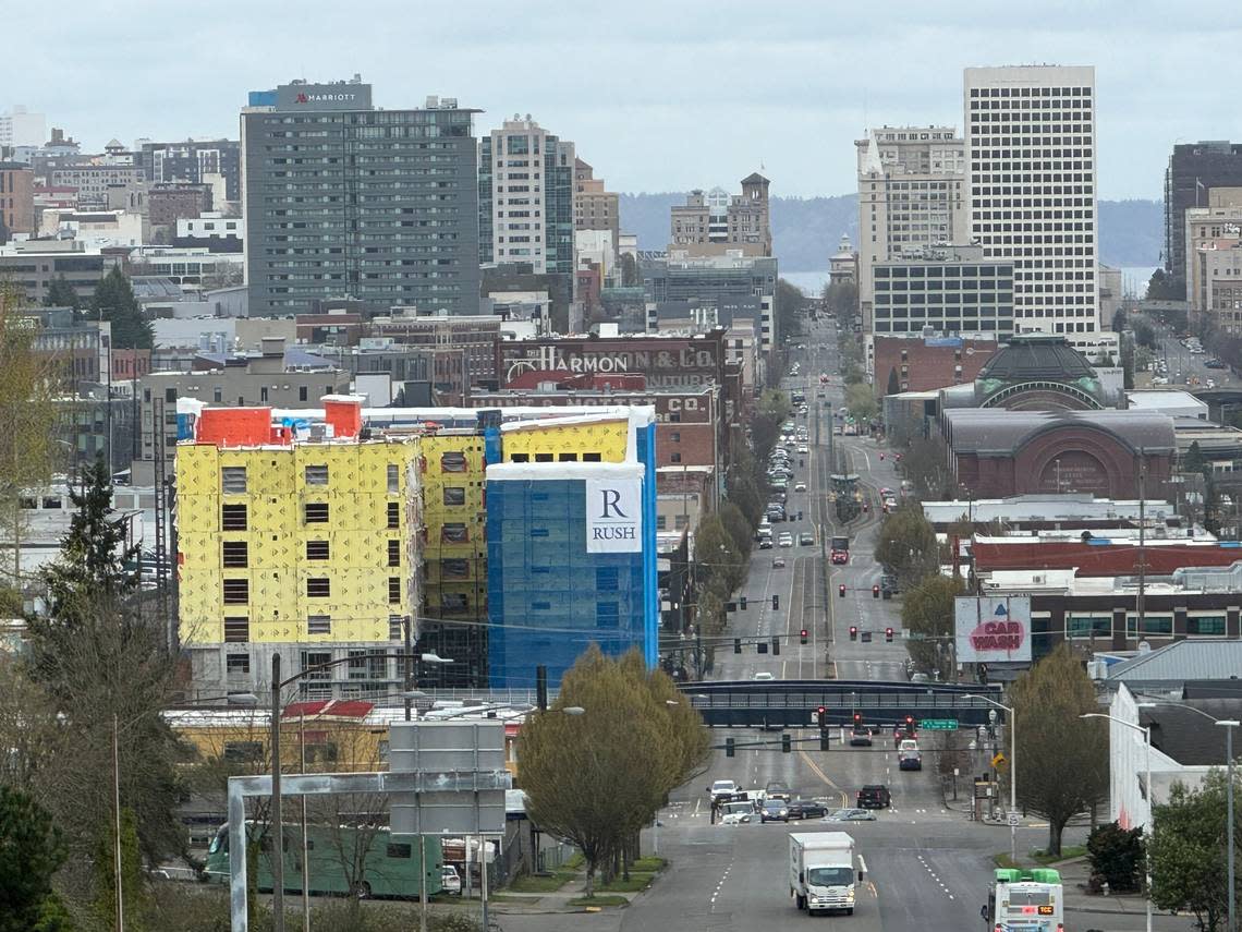 Cornus House apartment construction can be seen at left amid Tacoma’s cityscape looking down Pacific Avenue on Monday, March 25, 2024. Craig Sailor/The News Tribune