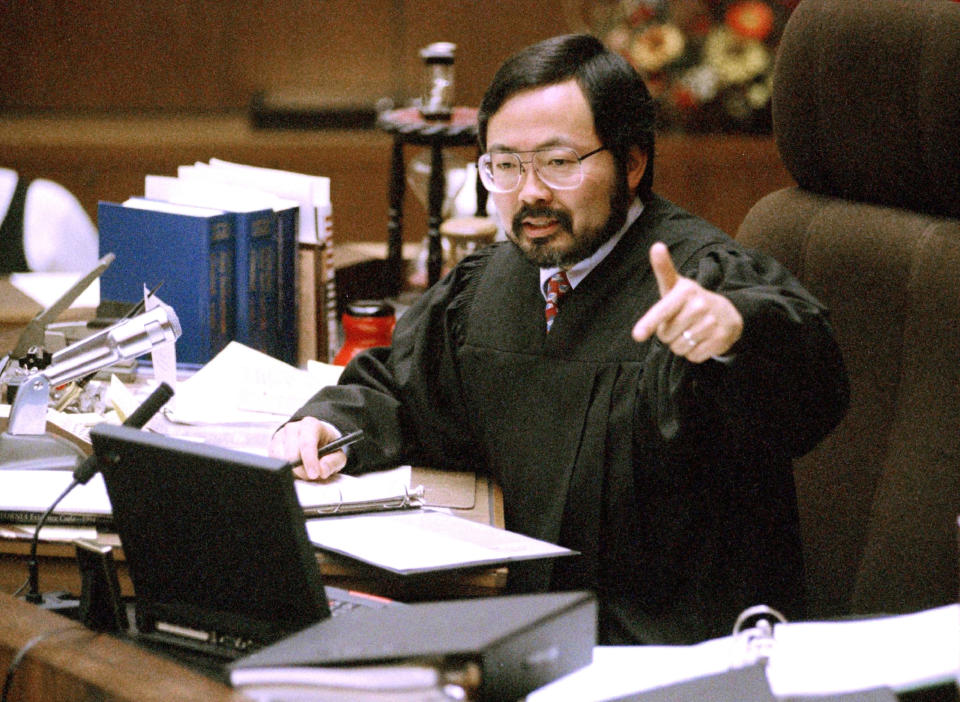 FILE - Judge Lance Ito gives instructions to the jury before all parties in the O.J. Simpson double murder trial depart on a tour of four prominent Brentwood sites in Los Angeles, Feb. 12, 1995. (AP Photo/Reed Saxon, Pool, File)