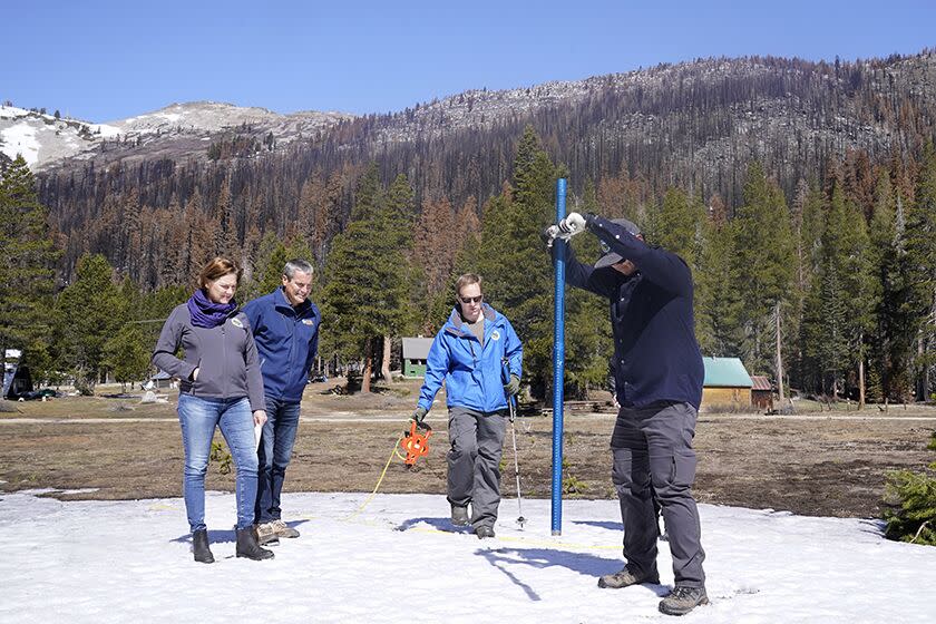 Sean de Guzman of the California Department of Water Resources measures snow near Echo Summit, Calif.