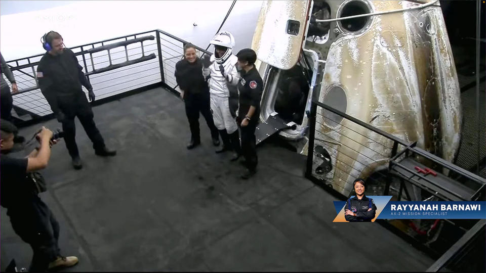 Unlike returning long-duration station fliers, who are carried to stretchers after exiting their capsules, all four Ax-2 crew members were able to walk away under their own power, albeit with assistance from support crews, after their relatively short mission. Here, Saudi astronaut Rayyanah Barnawi waves and flashes a thumbs up before leaving the area. / Credit: SpaceX