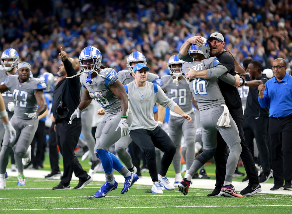 DETROIT, MICHIGAN - DECEMBER 05: Jared Goff #16 of the Detroit Lions celebrates with head coach Dan Campbell after defeating the Minnesota Vikings 29-27 to win their first game of the season at Ford Field on December 05, 2021 in Detroit, Michigan. (Photo by Rey Del Rio/Getty Images)