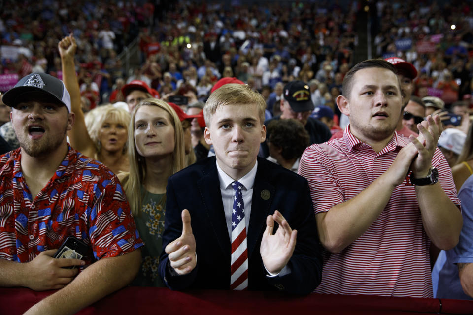 Supporters of President Donald Trump cheer as he speaks during a campaign rally at the Ford Center, Thursday, Aug. 30, 2018, in Evansville, Ind. (AP Photo/Evan Vucci)