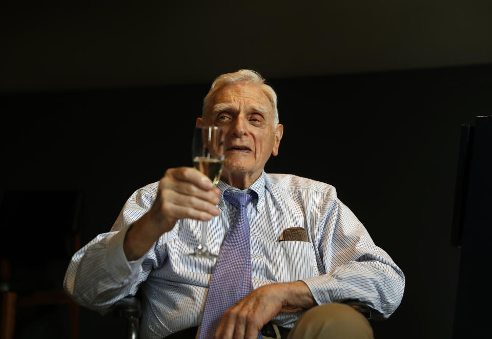 Nobel chemistry winner John B. Goodenough poses for the media at the Royal Society in London, Wednesday, Oct. 9, 2019. The 2019 Nobel Prize in Chemistry has been awarded to John B. Goodenough, M. Stanley Whittingham and Akira Yoshino for the development of lithium-ion batteries. (AP Photo/Alastair Grant)