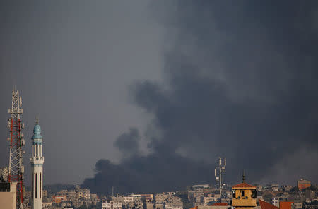 Black smoke is seen near the Israel-Gaza border, east of Gaza city May 29, 2018. REUTERS/Suhaib Salem