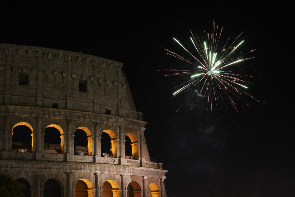 Fireworks explode in the sky over Rome's Colosseum during New Year's celebrations, in Rome, Tuesday, Jan. 1, 2019. (AP Photo/Andrew Medichini)