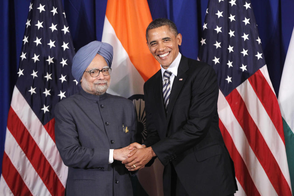 FILE - In this Nov. 18, 2011 file photo, U.S. President Barack Obama meets with India's Prime Minister Manmohan Singh on the sidelines of the ASEAN and East Asia summit in Nusa Dua, Bali, Indonesia. On Friday, Jan. 20, 2020, The Associated Press reported on a manipulated version of a photo similar to this circulating online incorrectly depicting Obama with Iranian President Hassan Rouhani. The manipulated image has circulated on social media and blogs since at least 2013. (AP Photo/Charles Dharapak)