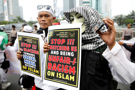 Islamists hold a protest rally outside Facebook's local headquarters accusing the social media giant of discrimination for blocking some pages operated by hardline groups in Jakarta, Indonesia January 12, 2018. REUTERS/Darren Whiteside