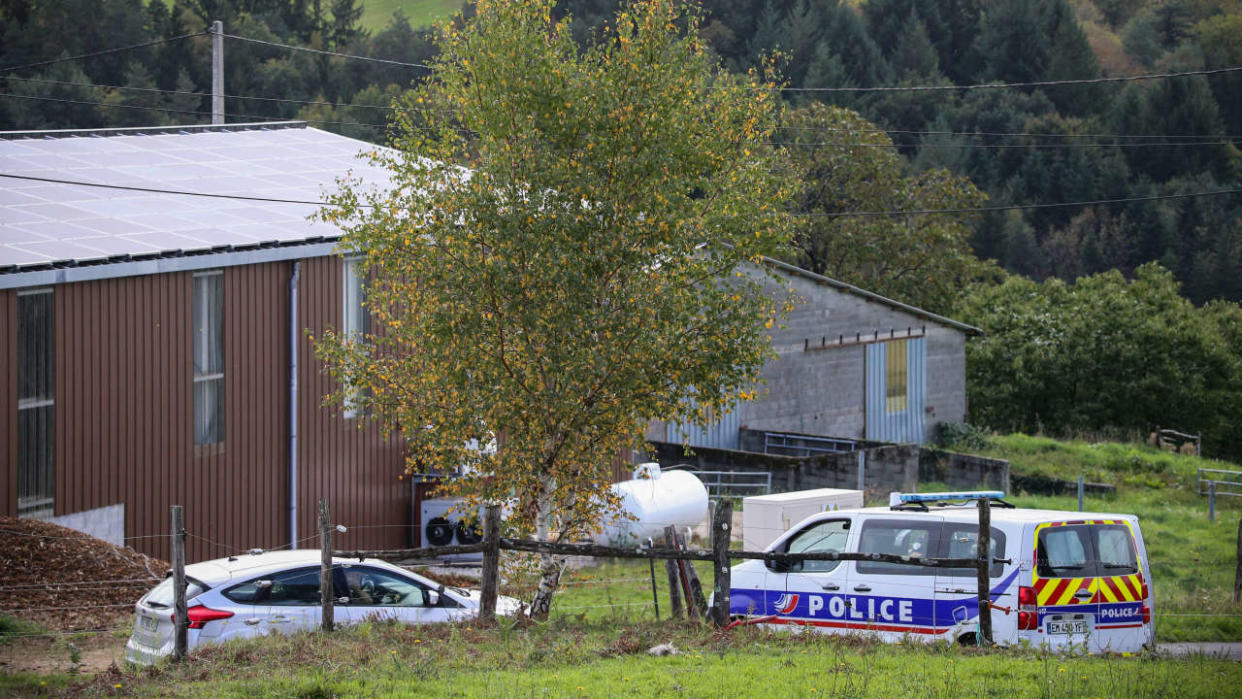 A police car is parked in front of a farm in Beynat, southwestern France, on October 27, 2022, after police found a body during the search for Justine Vayrac, who disappeared early morning on October 23, 2022. - Four days after the disappearance of Justine Vayrac this weekend in Brive, the suspect confessed on October 27, 2022 to raping and killing the 20-year-old woman, then a body was found near his home a few hours later. (Photo by DIARMID COURREGES / AFP)