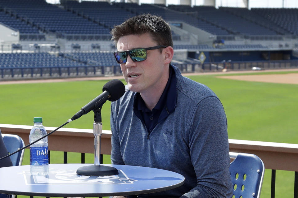 FILE - In this Feb. 12, 2020, file photo, Tampa Bay Rays general manger Erik Neander speaks to the media after pitchers and catcher reported for spring training baseball camp in Port Charlotte, Fla. Hundreds of young baseball players who would usually be celebrating being drafted by major league teams are now in limbo after the Major League Baseball draft was shortened from 40 rounds to five because of the coronavirus pandemic. “We don’t know really what to expect,” Tampa Bay Rays general manager Erik Neander said. "But (we're) doing our best to prepare and if we can provide opportunity to more players, that’s something that we’re going to lean on our scouts and our staff to identify the right players to do that with.” (AP Photo/John Bazemore, File)