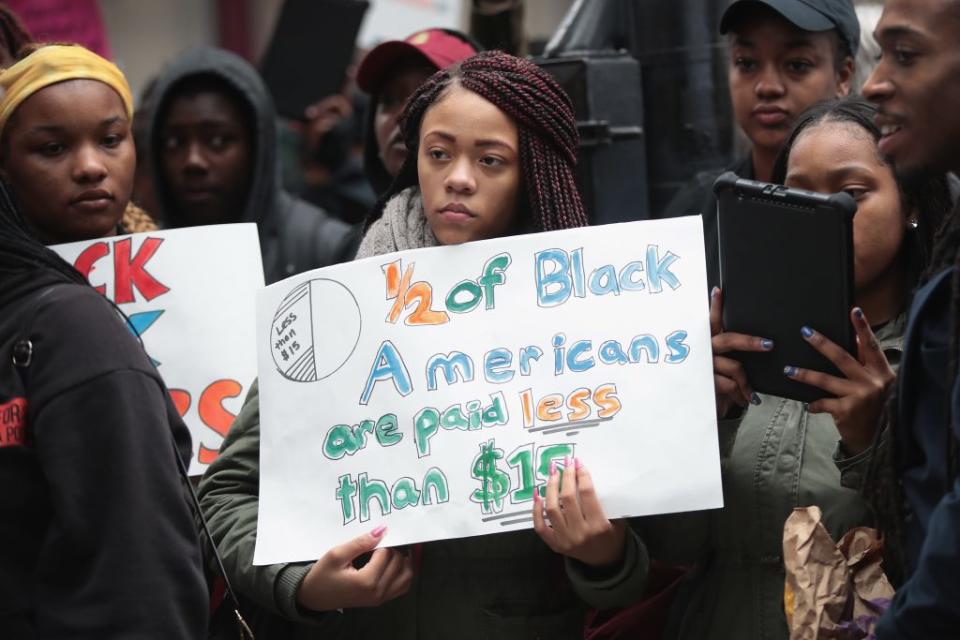 Demonstrators protest for higher wages and better working conditions on the 49th anniversary of the murder of Dr. Martin Luther King Jr. on April 4, 2017 in Chicago, Illinois. (Photo by Scott Olson/Getty Images)