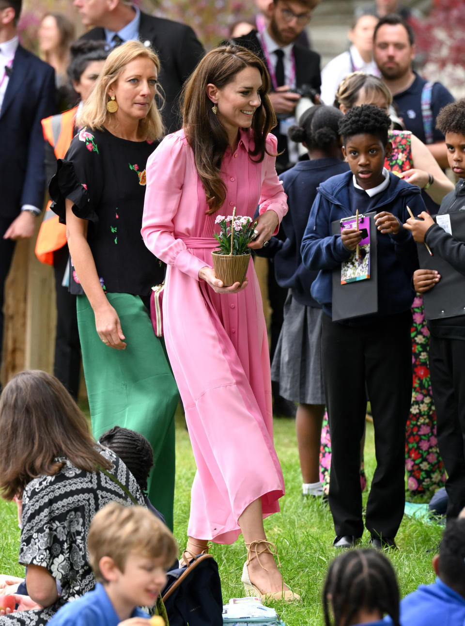 At the Chelsea Flower Show picnic, Kate brought back a two-tone pink ME + EM dress, accessorizing with Castañer wedges and Catherine Zoraida earrings.