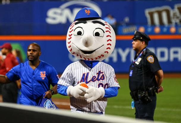 New York Mets team mascot Mr. Met wears a face mask while standing