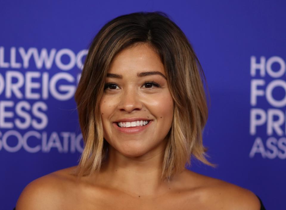 Gina Rodriguez looks like a minimalist goddess in this risqué LBD