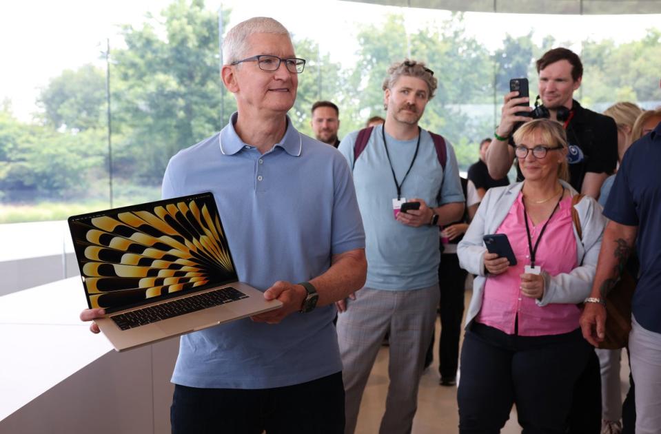 Apple chief executive Tim Cook with last year’s, then-new MacBook Pro 15-inch (Getty Images)