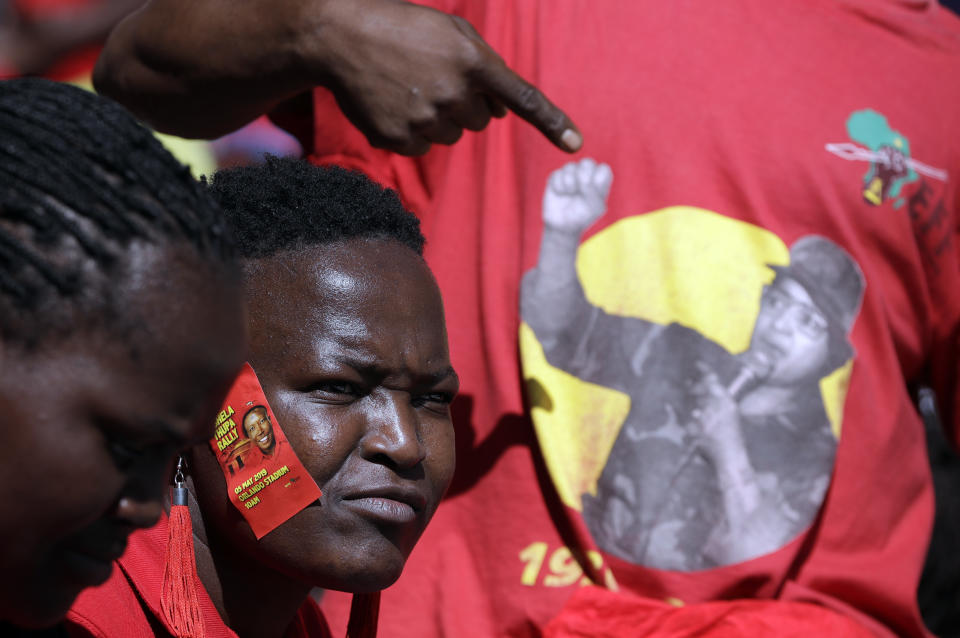 Supporters of the Economic Freedom Fighters (EFF) party, attend their election rally at the Orlando Stadium in Soweto, South Africa, Sunday, May 5, 2019, ahead of South Africa's election on May 8. (AP Photo/Themba Hadebe)