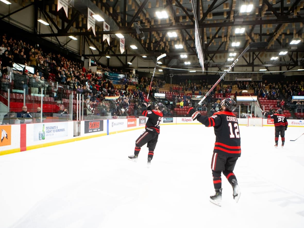 University of New Brunswick men's hockey players salute a sold-out crowd at the Aitken University Centre after completing a 30-0 regular season on Saturday. (James West/for UNB Athletics - image credit)