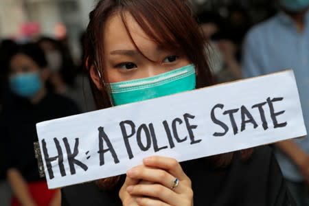 People attend a gathering to protest against what they say is the abuse of pro-democracy protesters by Hong Kong police, at Chater Garden in Central district, Hong Kong