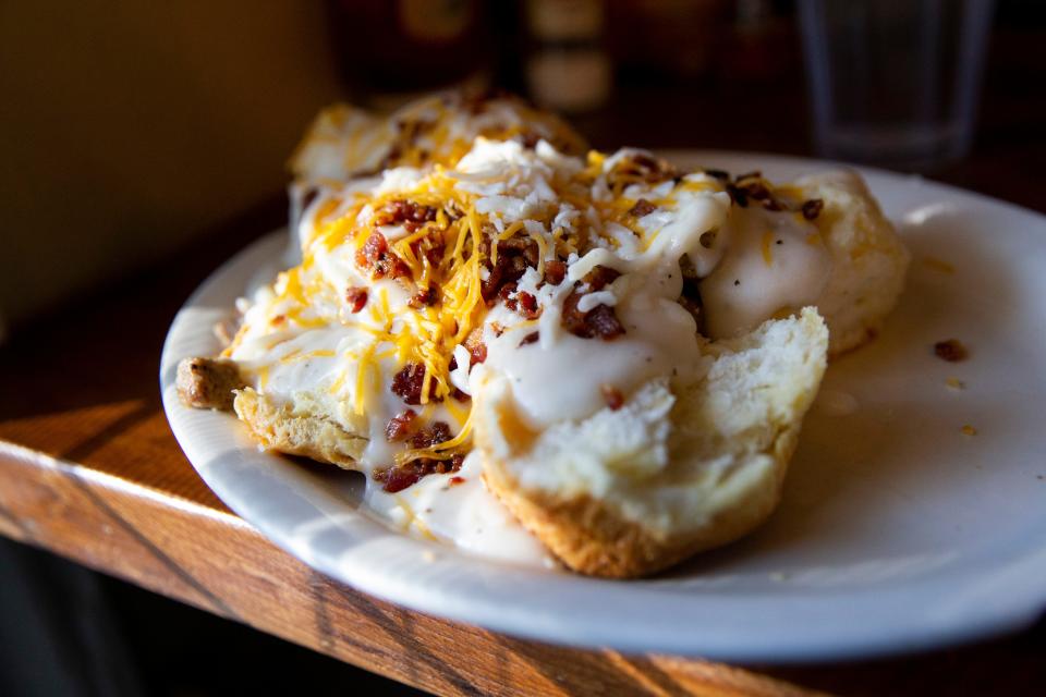 The loaded biscuits and gravy, which is made up of two eggs over medium, bacon, sausage, gravy, green onions and cheddar cheese, is seen at Brother Juniper’s at 3519 Walker Ave. near the University of Memphis.